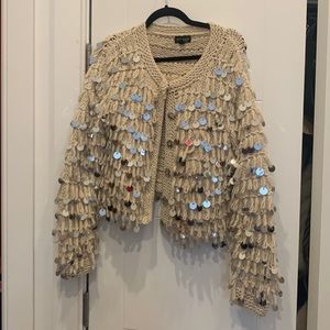 TOPSHOP blush sweater with mirror decor.